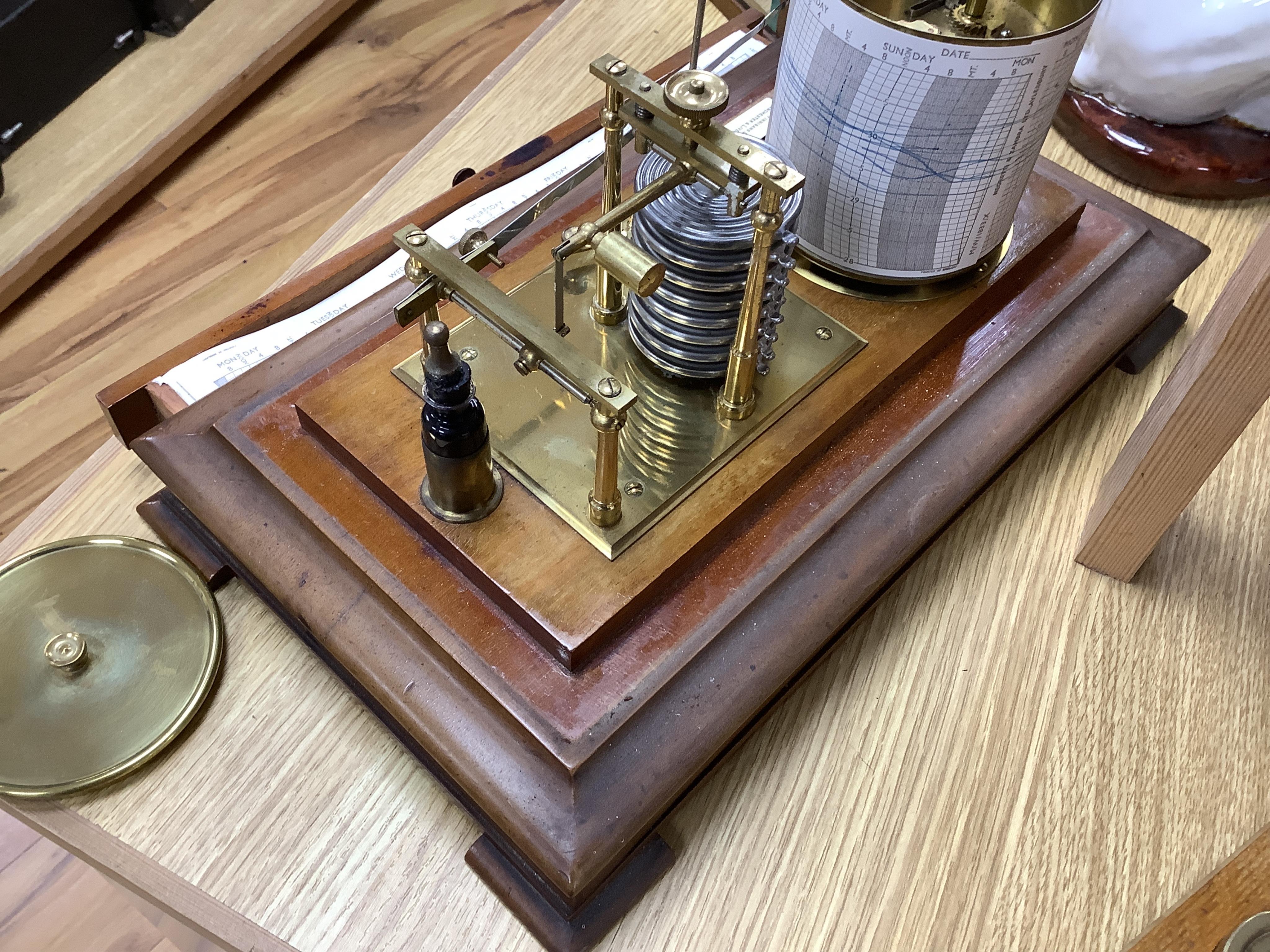 An early 20th century oak cased barograph by Finnigans Ltd., Manchester & Liverpool, with integral drawer underneath containing spare papers